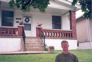 John Gregory in front of Joe Garagiola's boyhood home