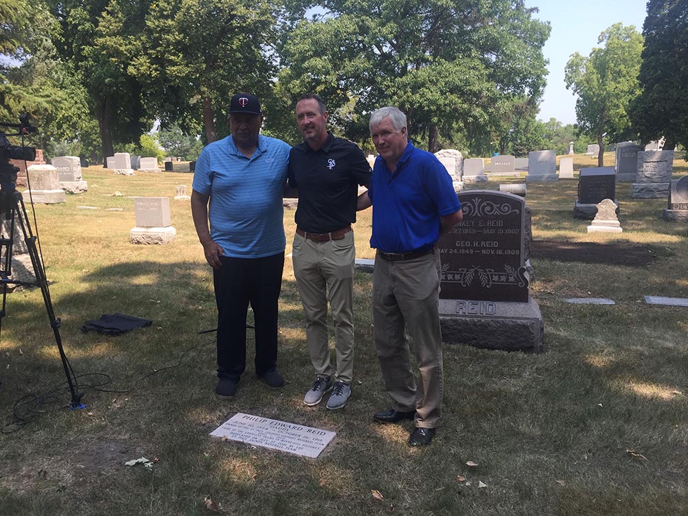 Frank White, Derek Sharrer, and Todd Peterson at Phil Reid's grave
