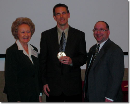 Tom Swift receiving the Seymour Medal, flanked by Dorothy Seymour Mills and SABR Executive Director John Zajc